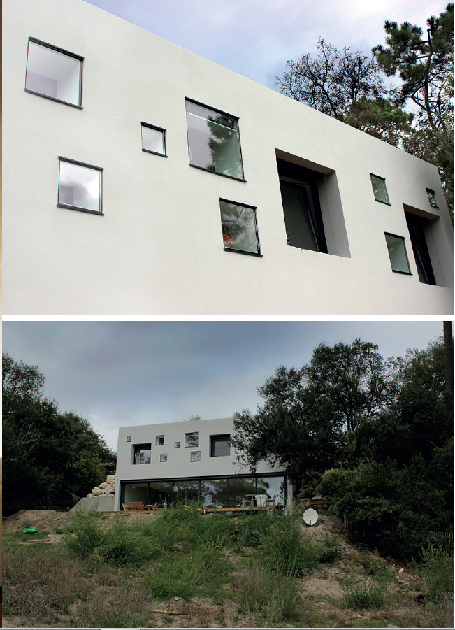 Vues de l'extérieur de la troglodyte house, villa contemporaine construite en pente - Gustave Mambo